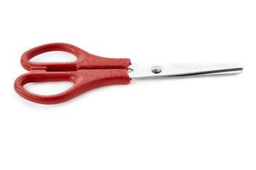 Red scissors isolated over the white background