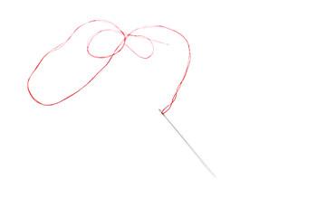 Small needle with thread isolated over the white background