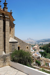 Fototapeta na wymiar Rear view of Santa Maria church with the lovers mountain to the rear, Antequera, Spain.