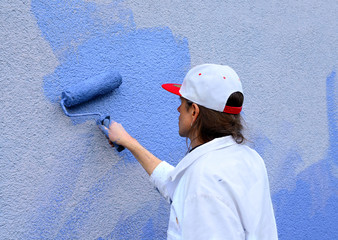 workman painting the wall