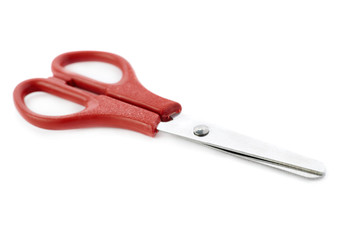 Red scissors isolated over the white background