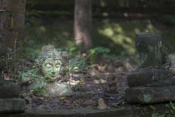 Fototapeta premium Damaged Buddha statue Thailand.