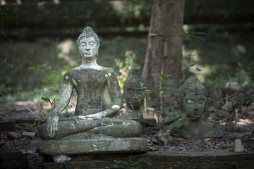 Damaged Buddha statue Thailand.