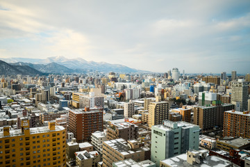 Fototapeta na wymiar SAPPORO, JAPAN - December 22, 2015: Street view of Buildings aro