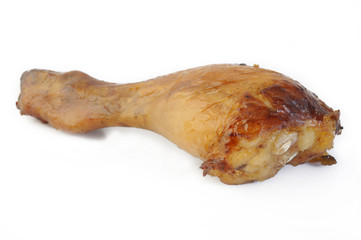 Baked chicken drumstick on white background