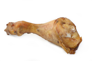 Baked chicken drumstick on white background