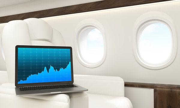 Laptop with chart in airplane
