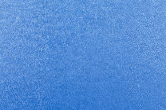 background: close-up of blue leather fabric