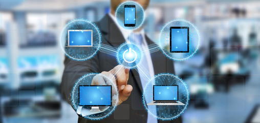 Businessman connecting tech device with his finger