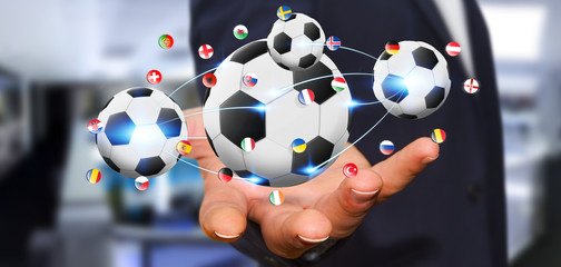 Businessman holding football in his hand