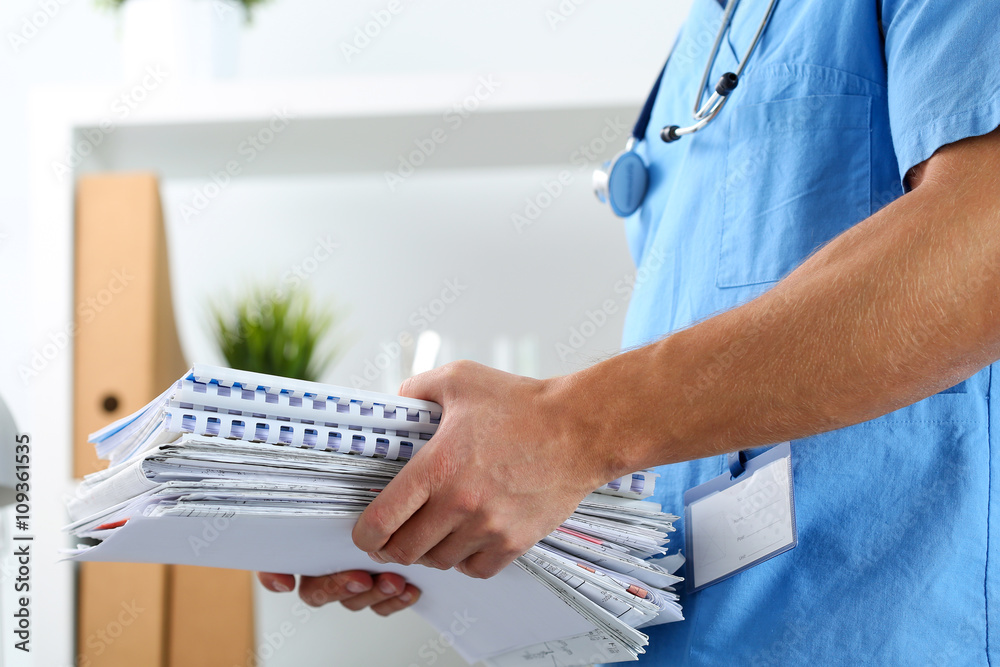 Wall mural hands of medicine therapeutist doctor wearing blue uniform