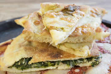 overlapping wedges of home-made pizza