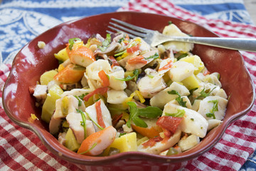 sea salad in a red tureen