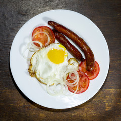 Fried eggs in a white plate