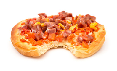 pizza with meat maize and carrot with a bite on white background