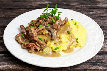 Beef Stroganoff with mashed potatoes.
