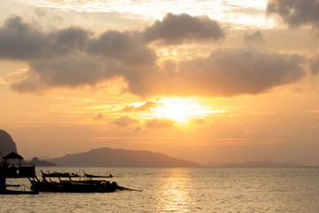 Naklejka na ściany i meble Sea with sunrise in harbor at Phang Nga,Thailand