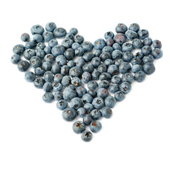 Heart shaped Bilberry or blueberry composition over isolated white background