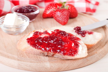 bread spread with strawberry jam
