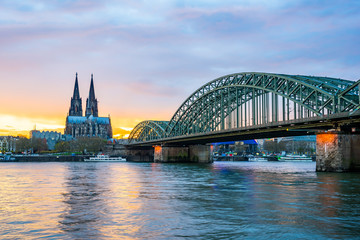 Sunset at the Cologne Cathedral with Hohenzollern Bridge in Colo