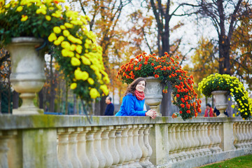 Beautiful young tourist in Paris on a fall day