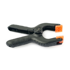 Obraz premium Clamp with orange plastic jaws, isolated over the white background
