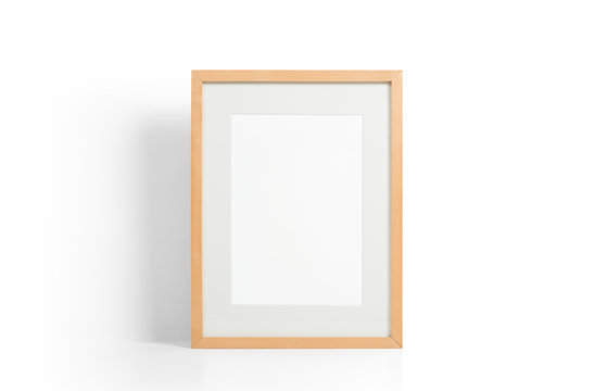 Wooden picture frame on white desk