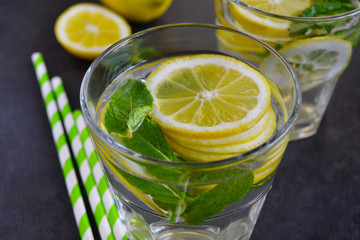 Summer Citrus lemonade with mint on black background