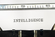 word intelligence typed on typewriter