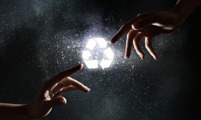 Fototapeta na wymiar Glowing recycle symbol