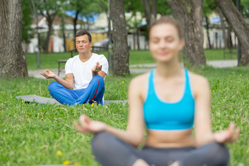 Having yoga practice in park