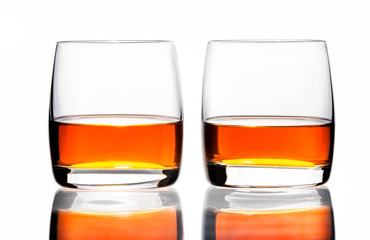 Two glasses of scotch whiskey  on a white background, isolated