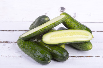 green cucumber on old boards