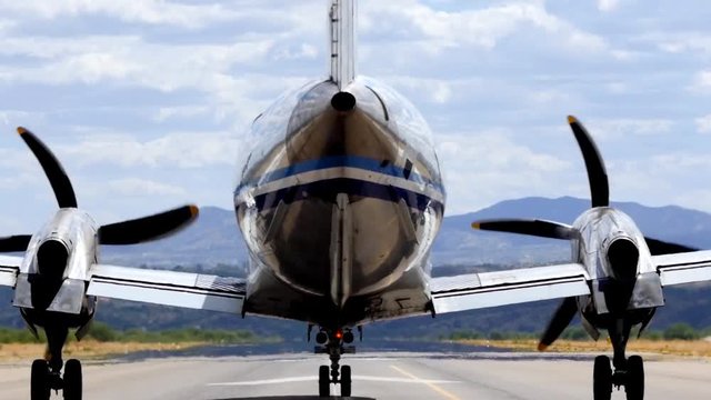 A twin turbojet airplane taking off