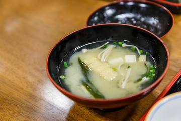 Japanese miso soup with tofu on the table.