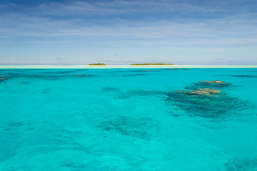 Shallow coral reef in turquoise transparent water, Aitutaki, Cook Islands