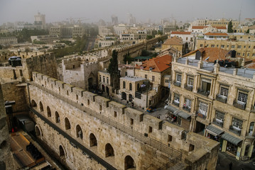 Obraz na płótnie Canvas Walls and castle of old city. Jerusalem panoramic roof view in time of sand storm. Israel