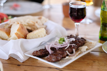 Kebab with glass of wine
