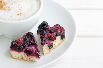 Sweet hearts and love coffee/two sweet cakes in the shape of a heart and a hot cup of coffee