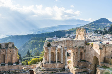 Fototapeta na wymiar Ruins of the ancient greek theater of Taormina. Etna view. Sicily. Italy.