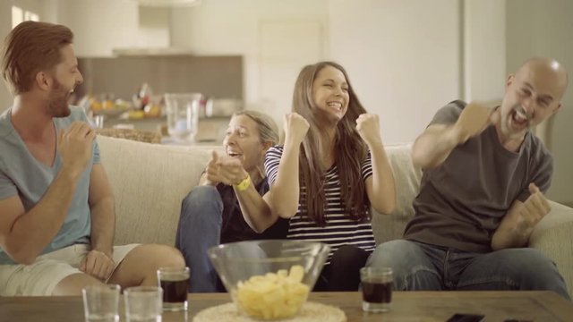4k footage, soccer fan couple watching tv at home disappointed with referee desicion
