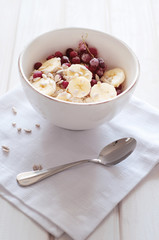 Healthy breakfast. Oatmeal with bananas, cranberries and sunflow