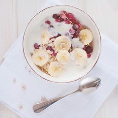 Healthy breakfast. Oatmeal with bananas, cranberries and sunflow