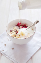 Healthy breakfast. Oatmeal with bananas, cranberries and sunflow