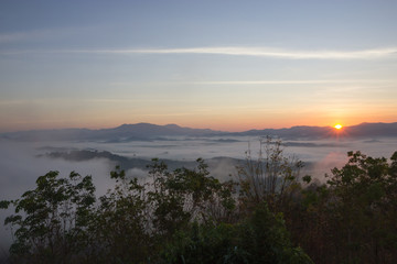 The sun rises in the mist at Khao Kai Nui, Phangnga Thailand