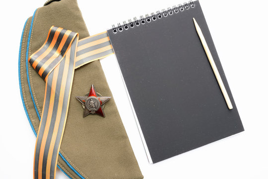 St. George ribbon, red star,notebook, field cap,