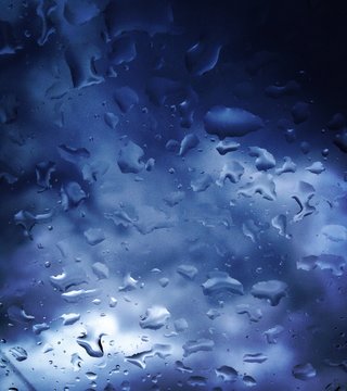 Rain drops on the car glass - shade of blue