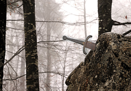 legendary Excalibur sword into the stone in the middle of the fo