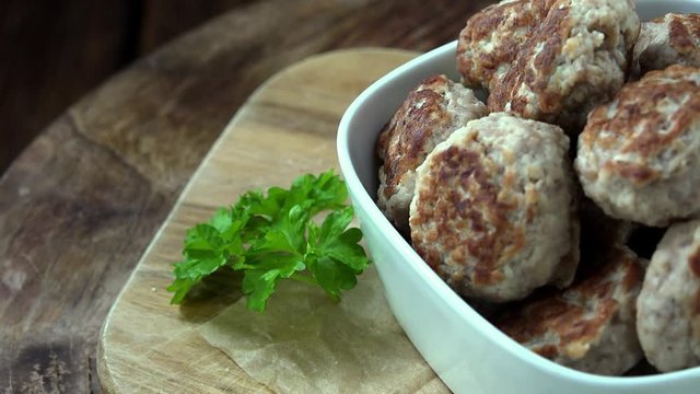 Portion of rotating Mini Burgers (seamless loopable 4K UHD footage)