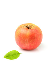 Ripe apple with leaf.